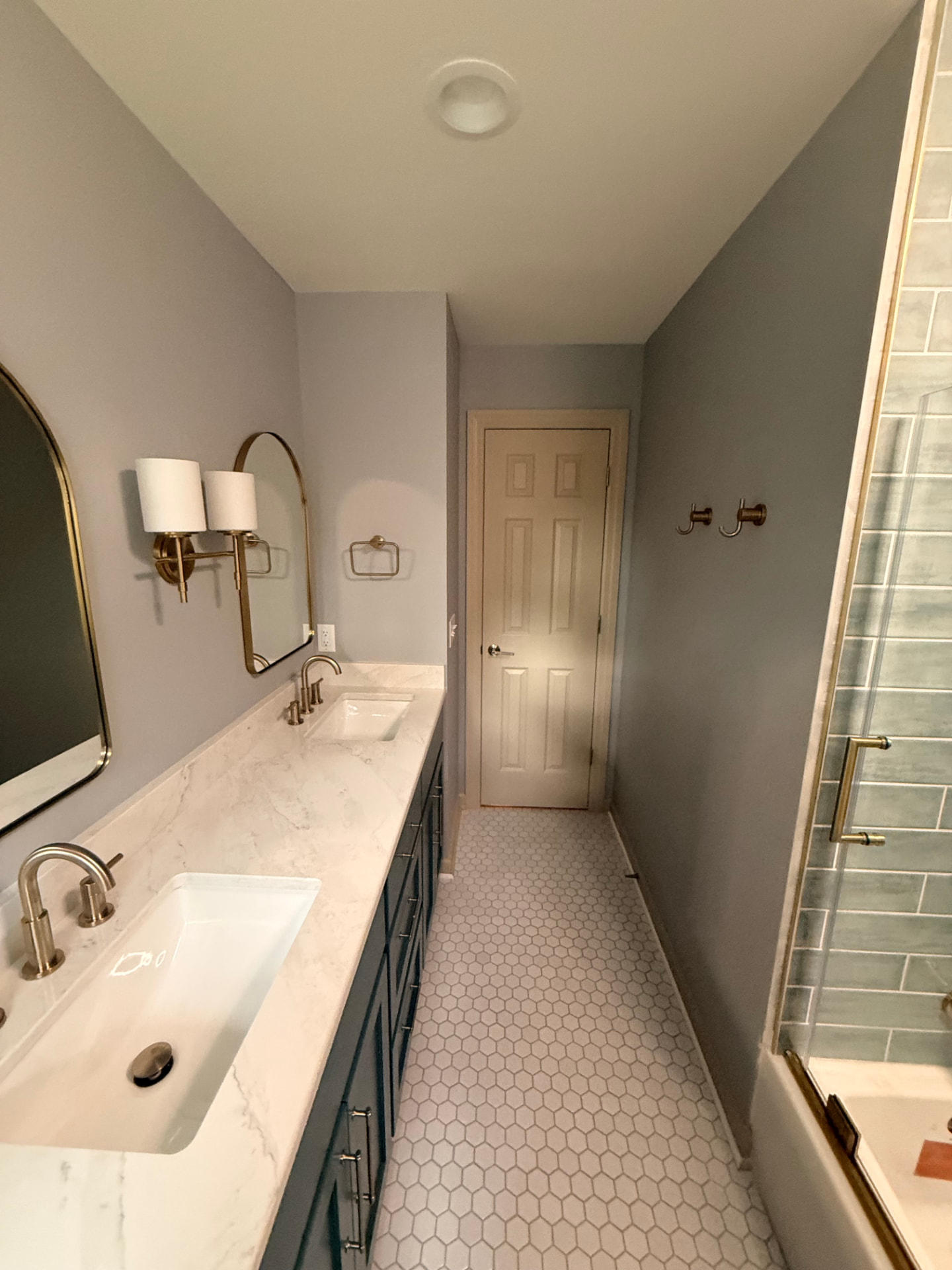 Completed vanity wall with crisp corners and flat painted surfaces down the full length of the bath