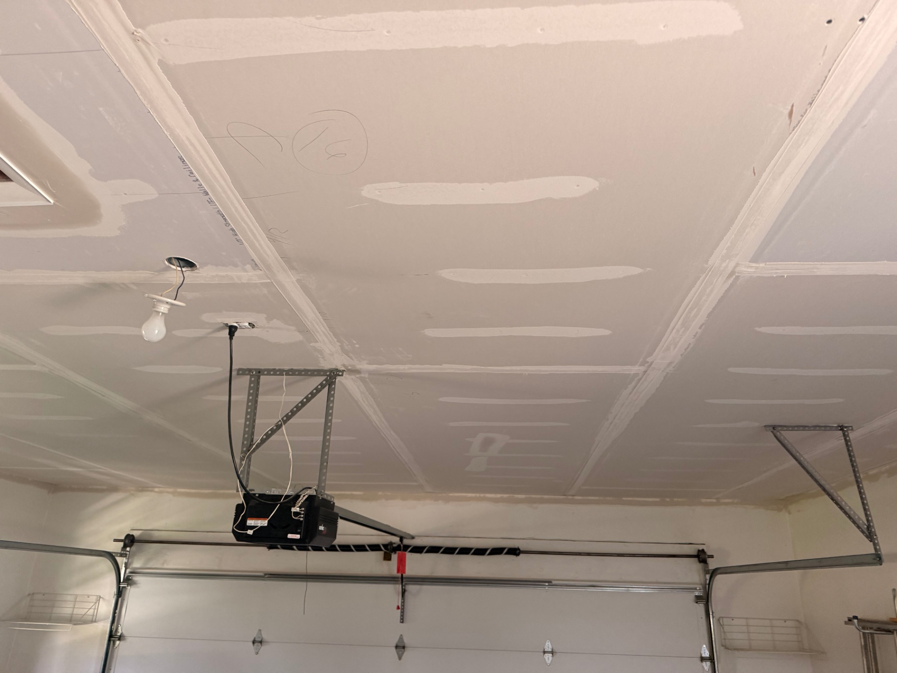 Seams taped and first coat of mud applied across the new ceiling board