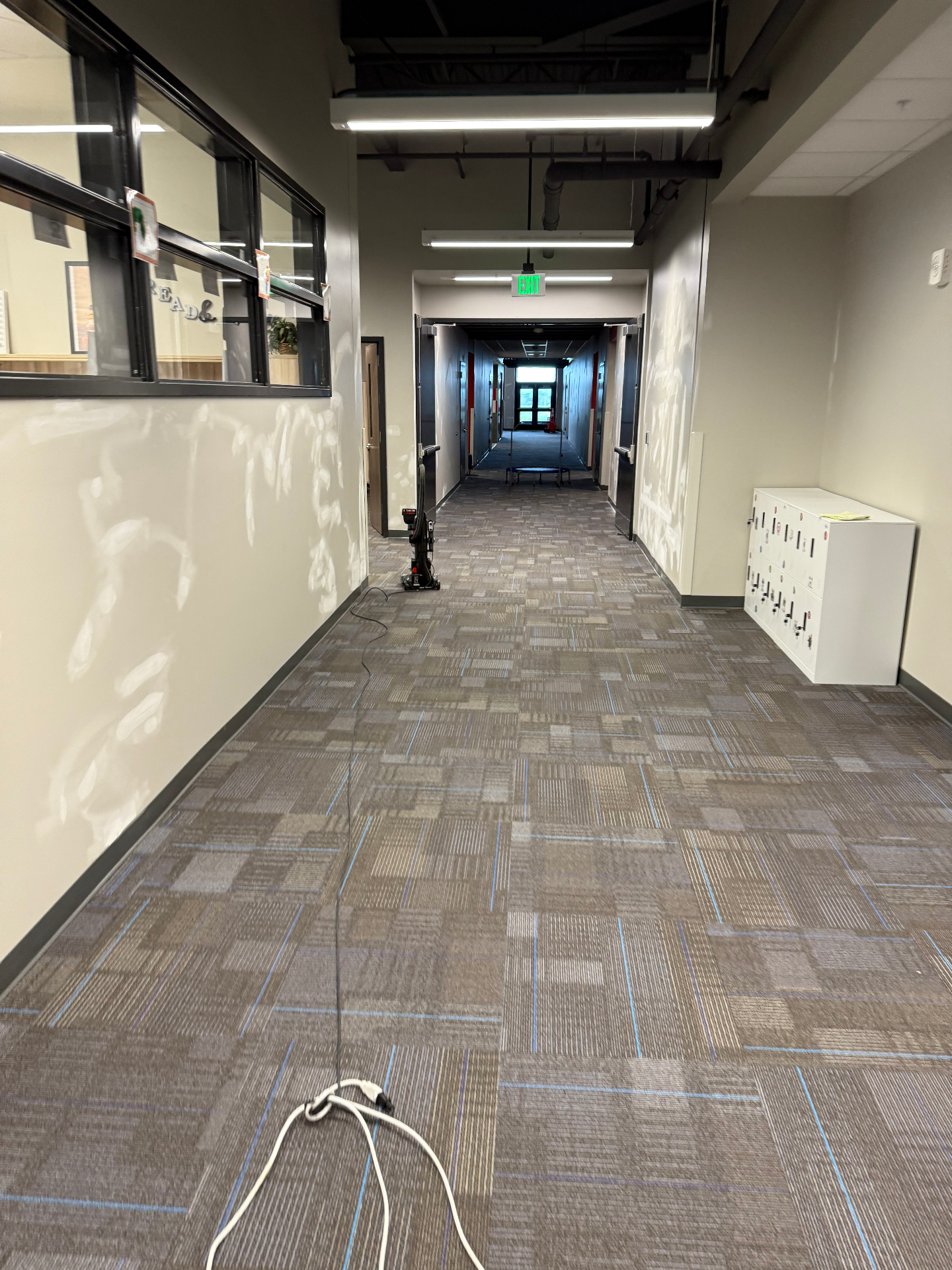 Wider hallway run with multiple wall touch-ups sanded smooth and prepped for primer and paint