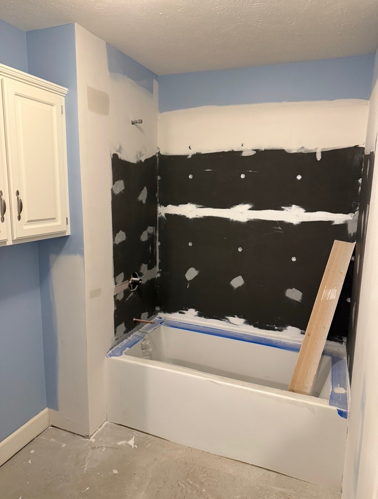 Tub surround built with cement board — taped and mudded for tile
