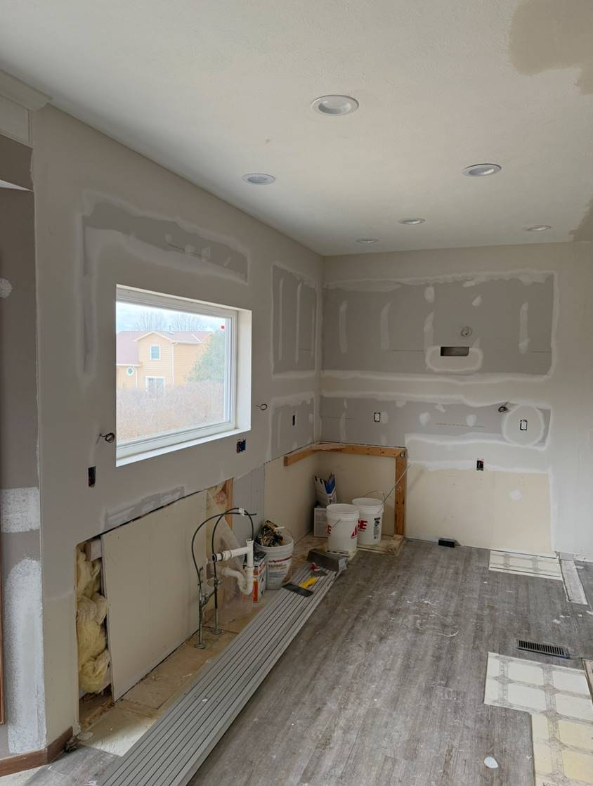 Kitchen mid-build — walls hung, taped, and ready for finish coats