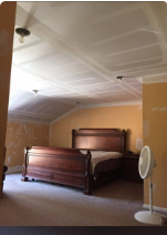 Vaulted bedroom ceiling — textured finish ready for paint